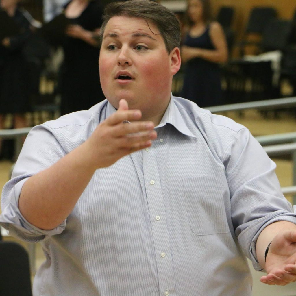 Photograph of Scott AuCoin conducting